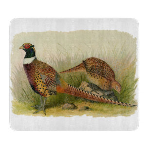 A pair of Ring necked pheasants in a grassy field Cutting Board