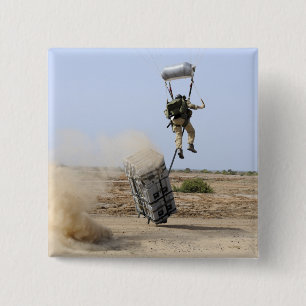 A pararescueman drops into the zone 15 cm square badge