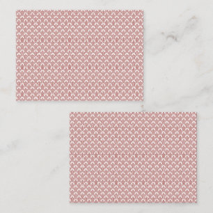 A patterned rug with red and brown motifs lies on appointment card