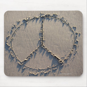 A peace sign drawn in the sand. mouse pad