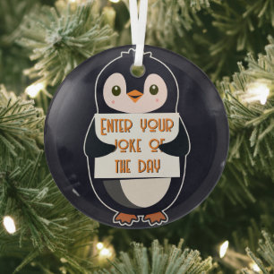 A penguin holding a sign with custom text glass tree decoration