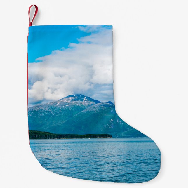 A peninsula of land covered in pine forest juts ou small christmas stocking (Front)