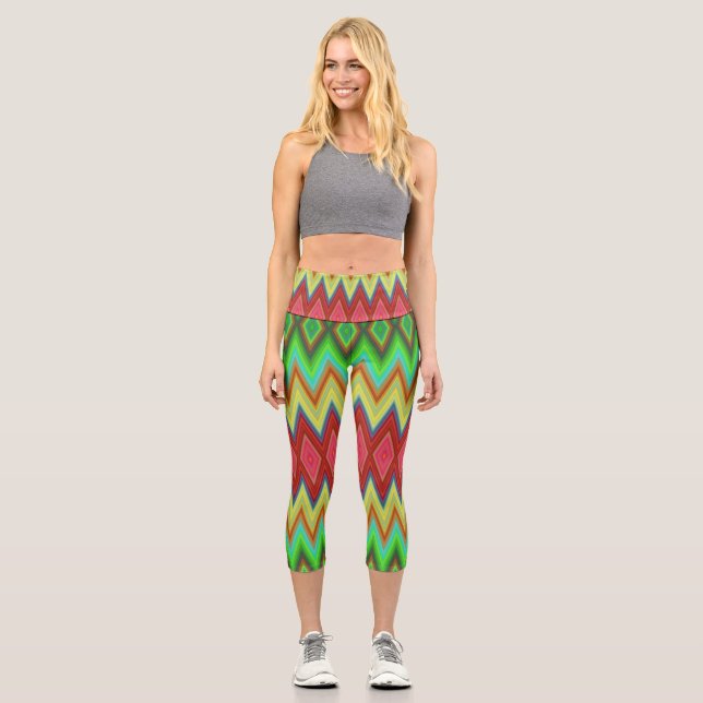 A person is wearing vibrant, geometric-patterned  capri leggings (Front)