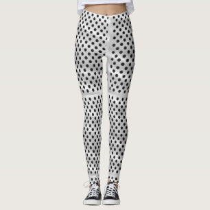 A person wearing high-waisted white leggings