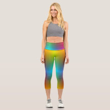 A person wearing vibrant, rainbow-gradient legging