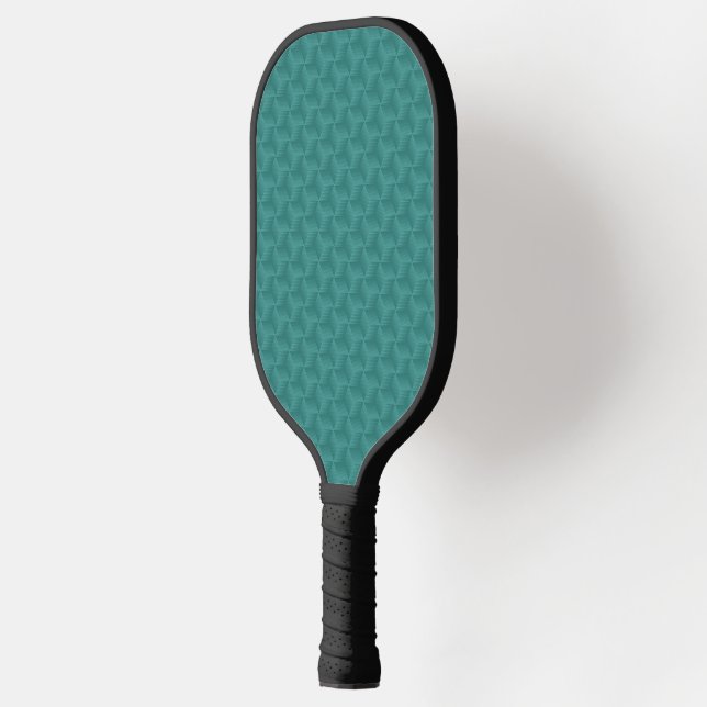 A pickleball paddle with a textured teal surface  (Left)