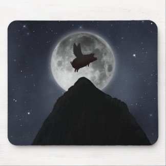 A pig flies across full moon over mountain peak mouse pad