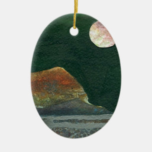 A pink and green moon rises over an alien world ceramic tree decoration