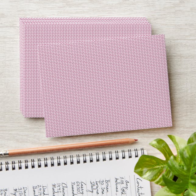 a pink and white background with wavy lines envelope (Stacked)