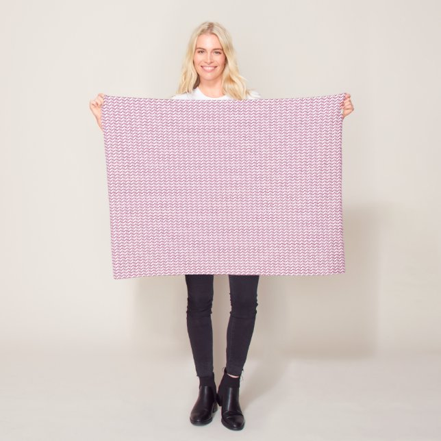 a pink and white background with wavy lines fleece blanket (In Situ)