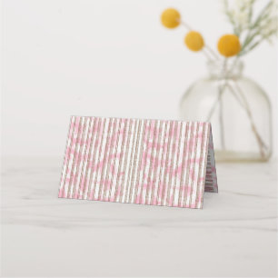 a pink and white striped background place card