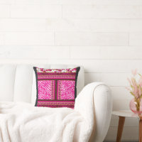 a pink and white wallpaper with a cross on it