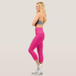 a pink background with a black border capri leggings<br><div class="desc">The design is a large blue square,  which appears to be a bright and clear sky. The colour of the sky is a deep shade of blue,  giving it a vibrant and lively appearance.</div>