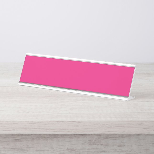 a pink background with a black border desk name plate (Front)