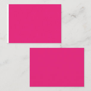 a pink background with a black place card