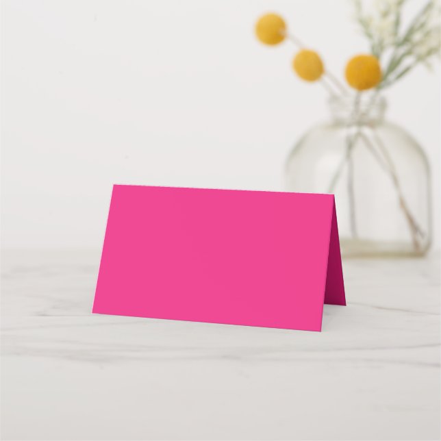 a pink background with a black place card (Front)