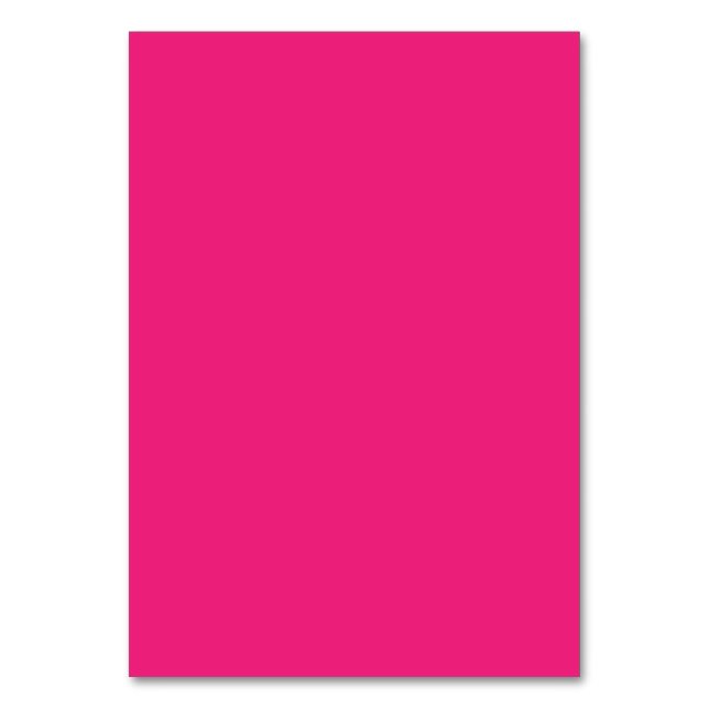 a pink background with a black table number (Front)