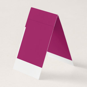 a pink background with a white border business card