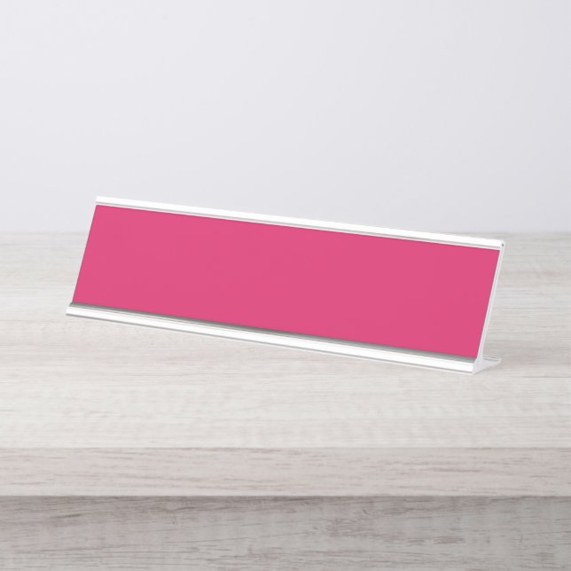 a pink background with a white border desk name plate (Front)