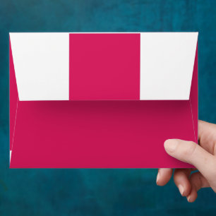 a pink background with a white border envelope