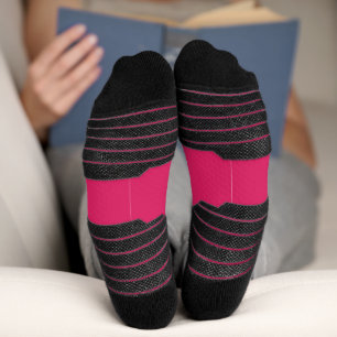 a pink background with a white border socks