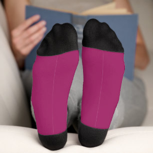 a pink background with a white socks