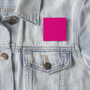a pink background with white polka dots 15 cm square badge