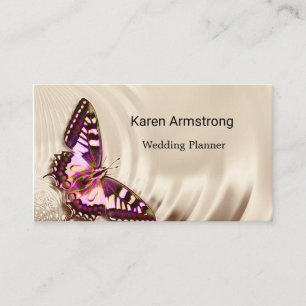 A pink butterfly on a cream satin background business card