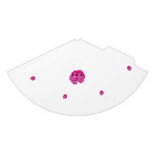 A pink flower with black spots on its petals, show party hat