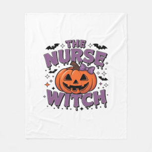 A playful design featuring a pumpkin witch with a fleece blanket