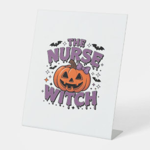 A playful design featuring a pumpkin witch with a  pedestal sign