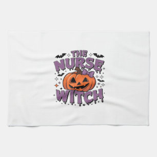 A playful design featuring a pumpkin witch with a  tea towel