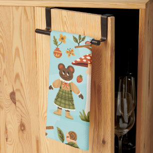 A playful fabric pattern featuring cartoon animals tea towel