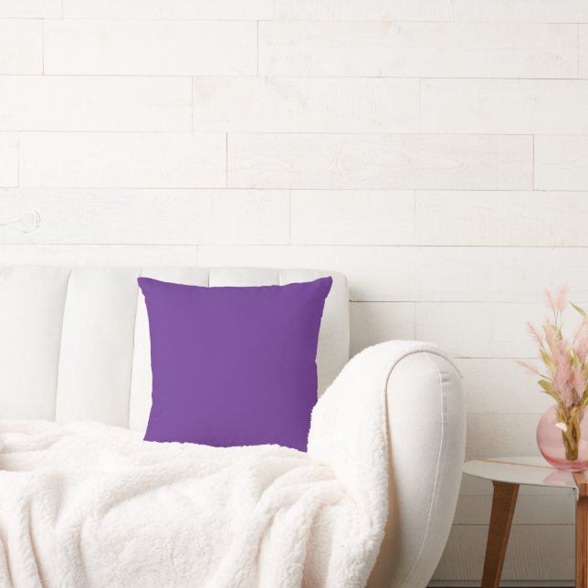 a purple background with a cushion (Couch)