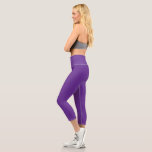 a purple background with a white border capri leggings<br><div class="desc">The design is a large blue square,  which appears to be a bright and clear sky. The colour of the sky is a deep shade of blue,  giving it a vibrant and lively appearance.</div>
