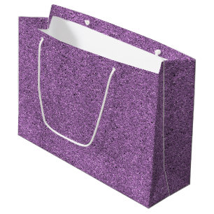 A purple glitter gift bag with a white handle