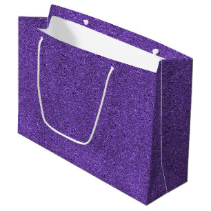 A purple glitter gift bag with a white handle