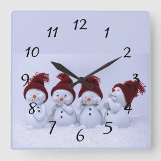A quartet of snowmen square wall clock