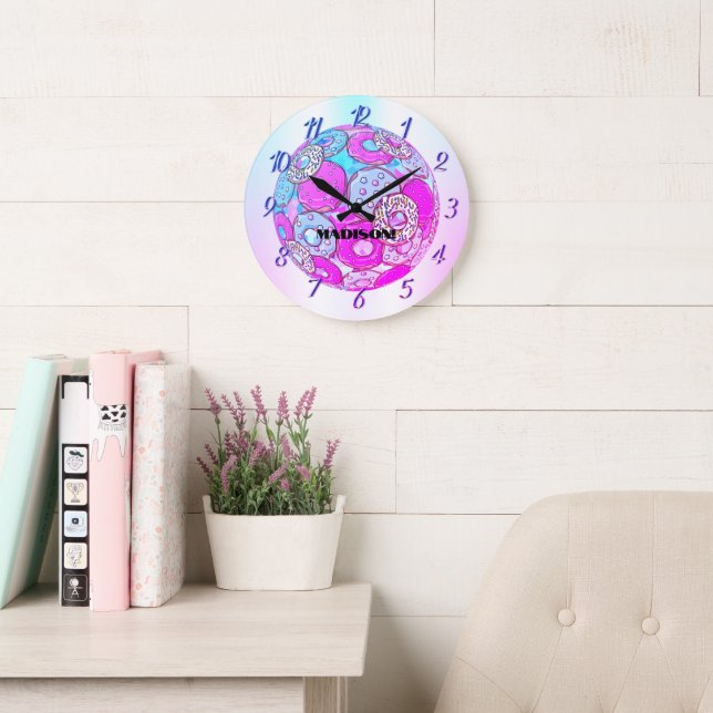 A rainbow of colours, a pink doughnut with a name  large clock (Reading Room)