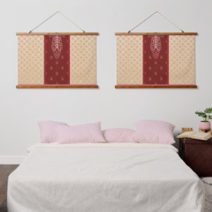 a red and beige carpet with a red border hanging tapestry