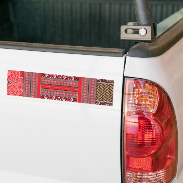 a red and black painting with a red heart on it bumper sticker (On Truck)