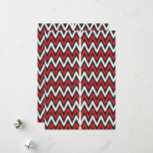 a red and black zigzag pattern on a white backgrou holiday card