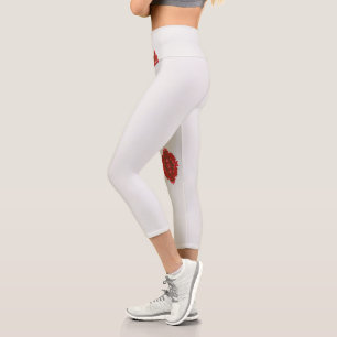 a red and brown design on a white background capri leggings