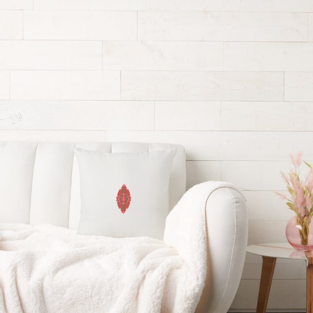 a red and brown design on a white background cushion (Couch)