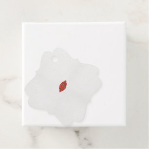 a red and brown design on a white background favour tags
