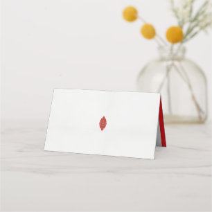 a red and brown design on a white background place card
