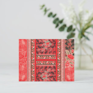a red and green floral design on a black backgroun postcard