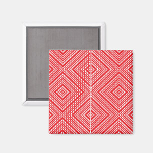 a red and white background with a diamond pattern magnet
