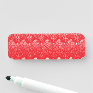 a red and white background with a lot of dots name tag