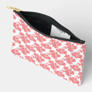 a red and white flower pattern on a white backgrou accessory pouch